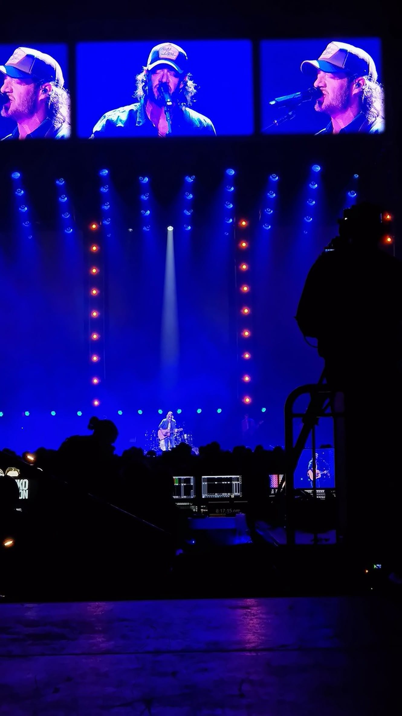 Front of house looking at a blue stage look and IMAG screens, Country 2 Country Festival, O2 Arena, March 2025.