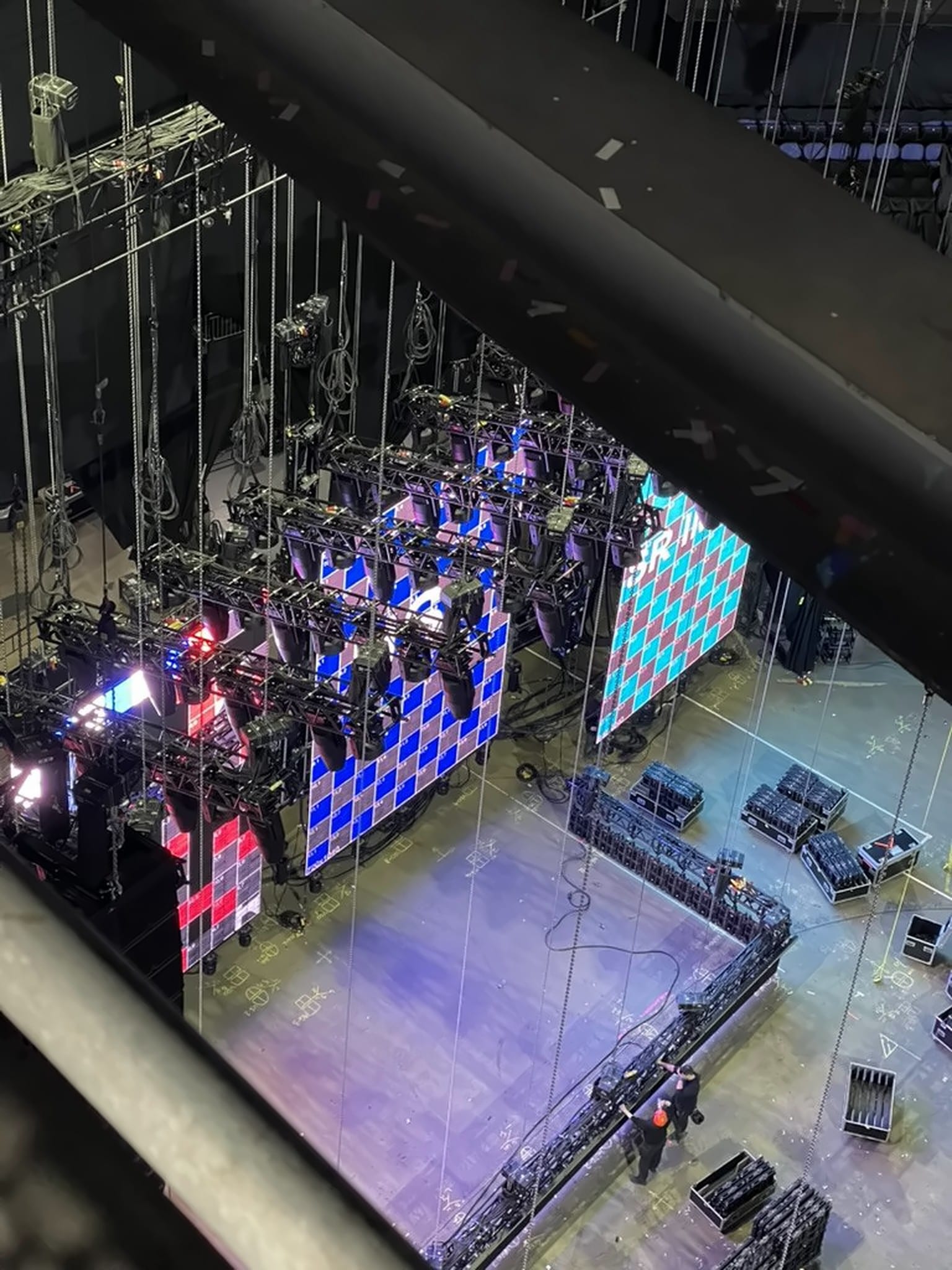 Overhead view of LED panels on checkerboard test patterns during load-in, Country 2 Country Festival, O2 Arena, March 2025.
