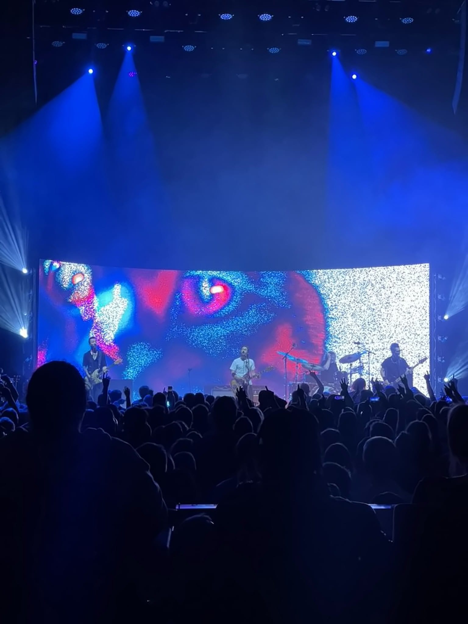 LED wall with a close feline eye and digital static, Feeder Comfort In Sound Tour 2025.