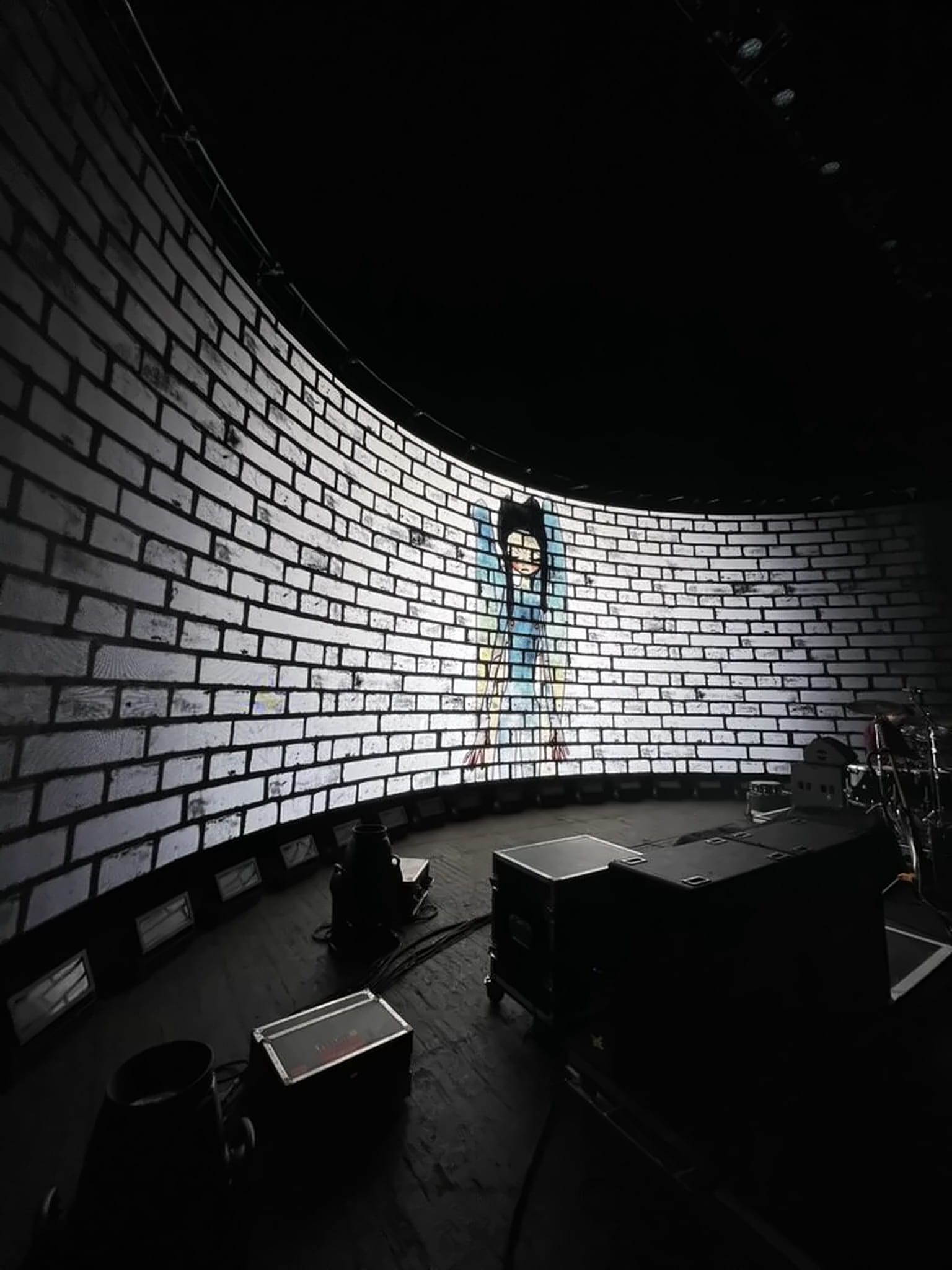 Album artwork on the curved LED wall during setup, Feeder Comfort In Sound Tour 2025.