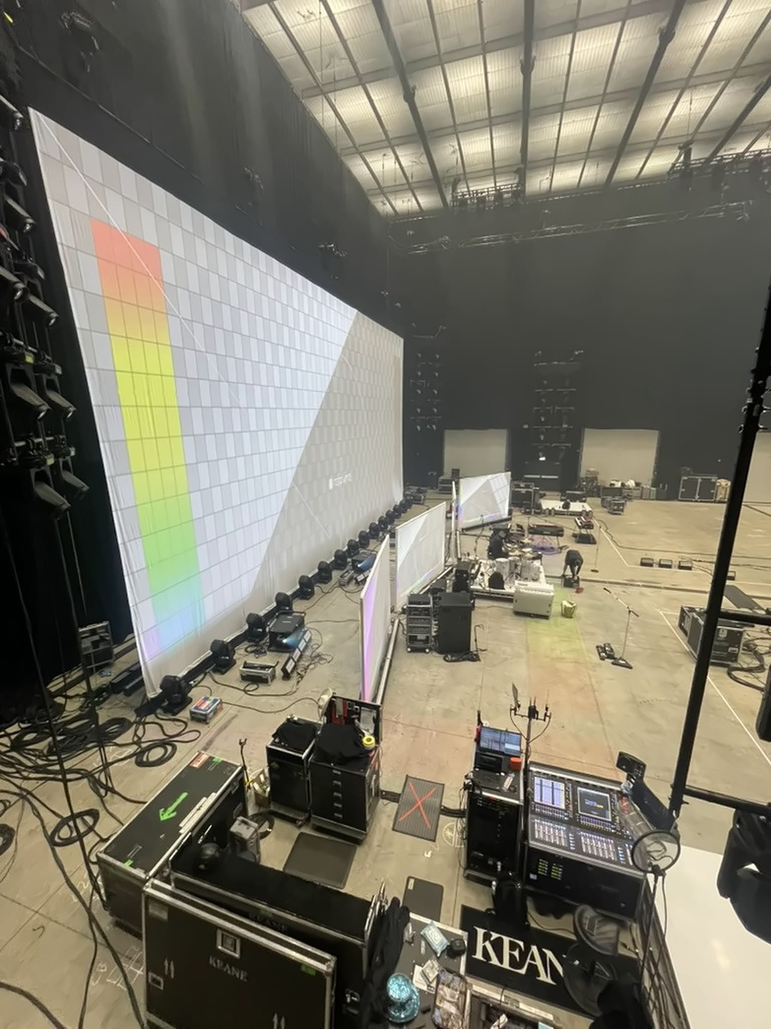 LED wall on a test pattern with a Keane-branded console and floor mat in the foreground, Hopes and Fears UK Arena Tour 2024.