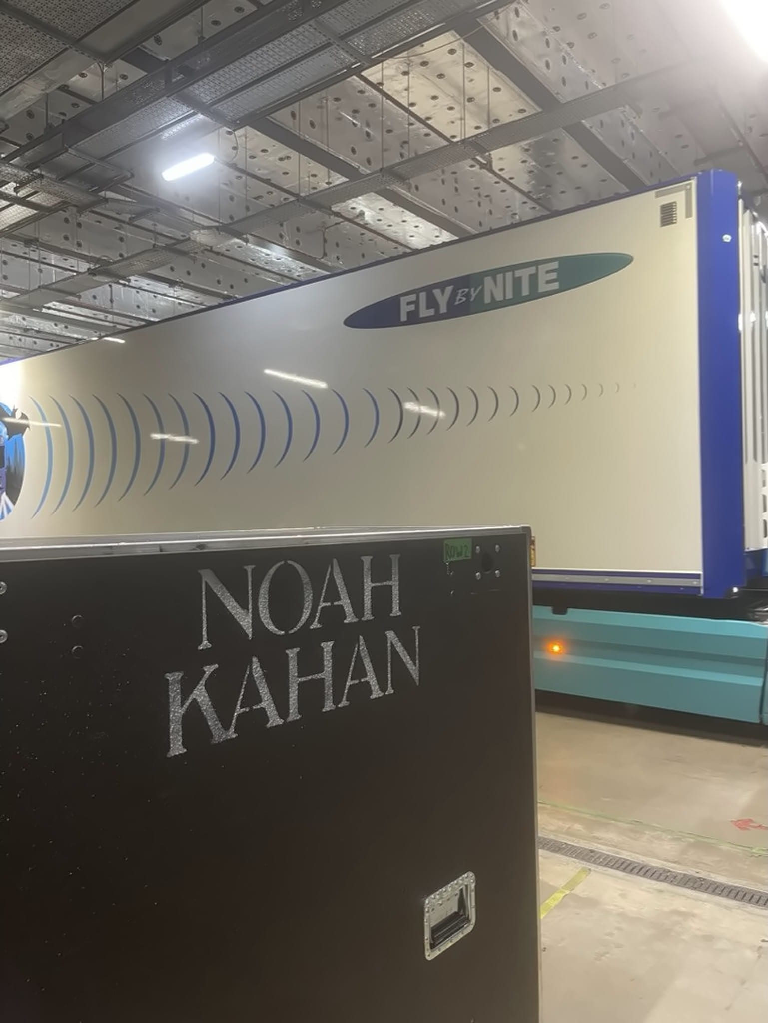 Noah Kahan flight case in front of a Fly By Nite trailer.