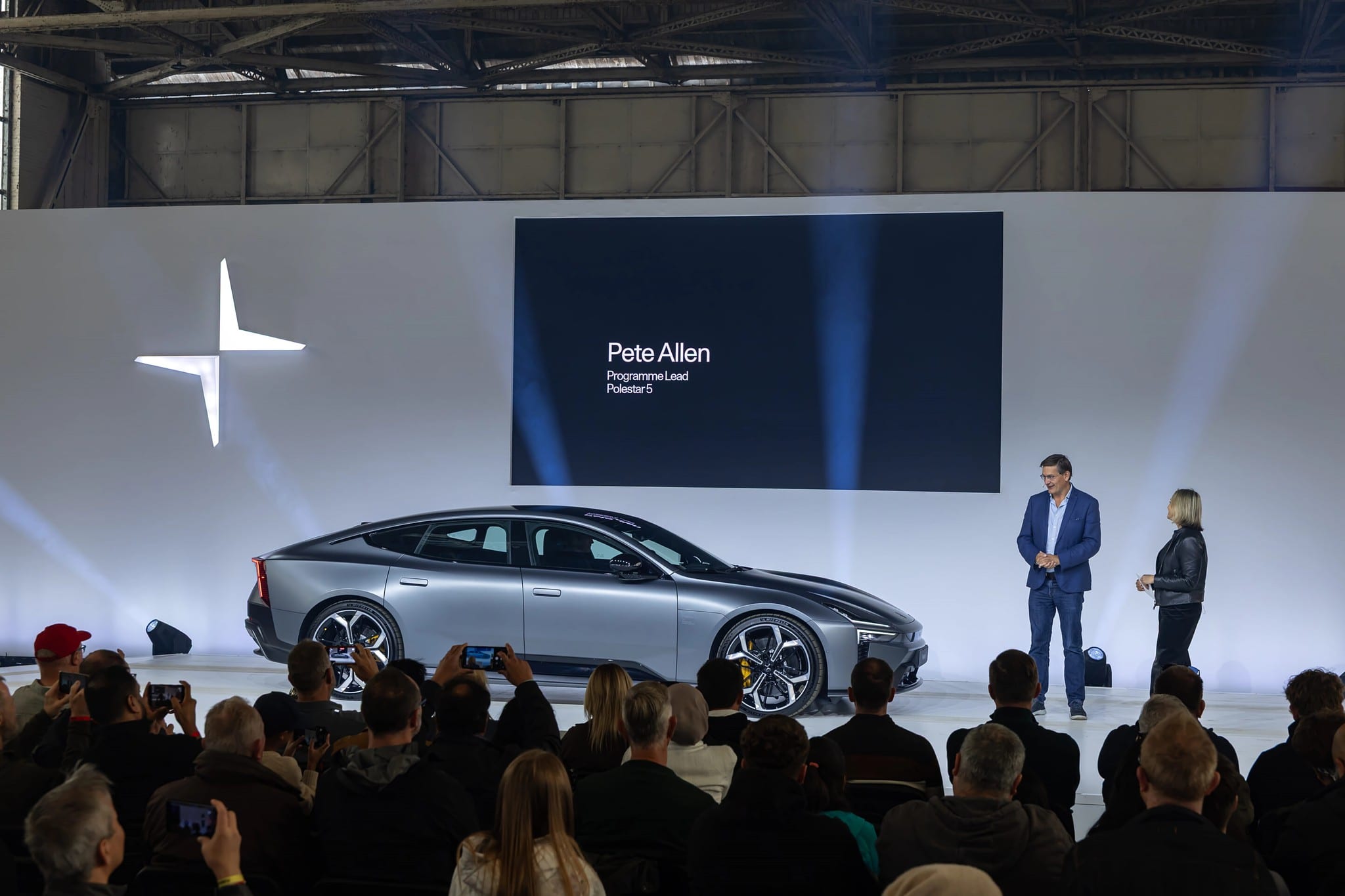 Polestar 5 reveal, LED showing Pete Allen, Programme Lead, audience filming, Polestar Festival, September 2025.