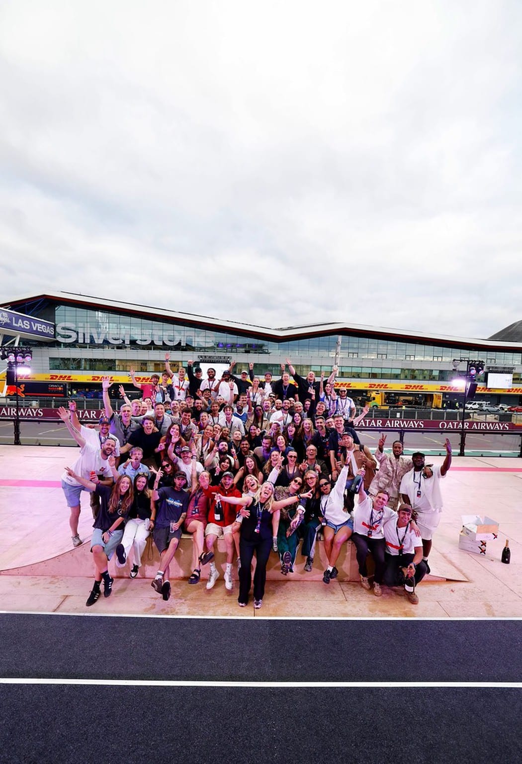 Crew wrap at Silverstone after Red Bull Pole Position 2025, group on the skate ramp with the Wing behind.